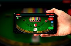 a mobile phone displaying an online blackjack game in progress